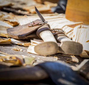 Close-up of wooden pieces and axes