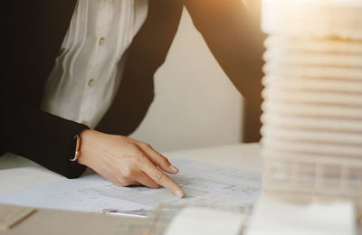 Close-up of woman working on table
