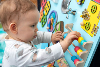 Close-up of cute girl playing with toy