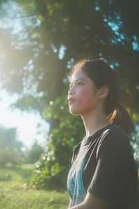 Thoughtful young woman looking away