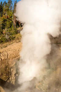 Smoke emitting from volcanic mountain