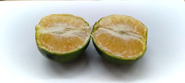 Close-up of fruits against white background