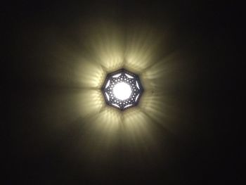 Low angle view of illuminated light bulb