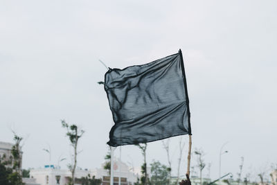 Low angle view of flag against sky