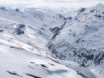 Scenic view of snow covered mountains 