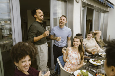 Portrait of smiling family sitting at home