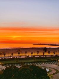 Scenic view of beach against sky during sunset