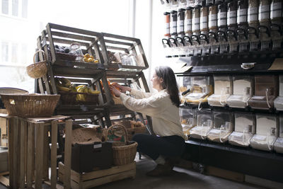 Woman working in organic shop