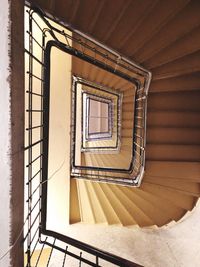 Directly below shot of spiral staircase in building