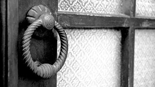 Close-up of rope tied to wooden door