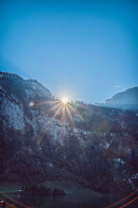 Scenic view of mountains against blue sky