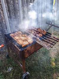 High angle view of meat on barbecue grill