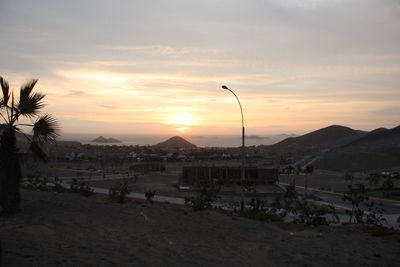 Scenic view of mountains against sky at sunset