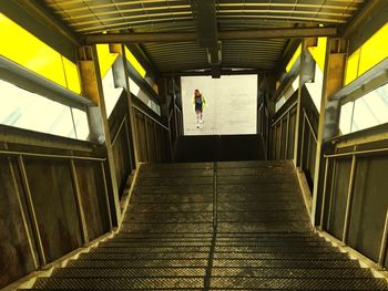 Man walking on staircase