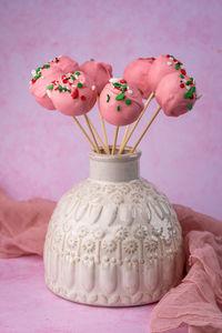 Homemade cake pops in a vase on the table