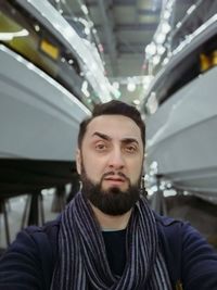 Portrait of young man in bus