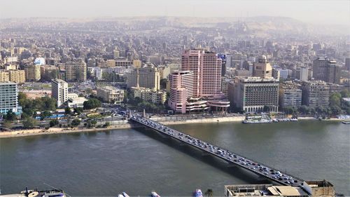 High angle view of river amidst buildings in city