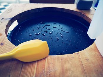 High angle view of wet lemon on table