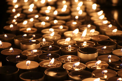 Close-up of illuminated tea light candles