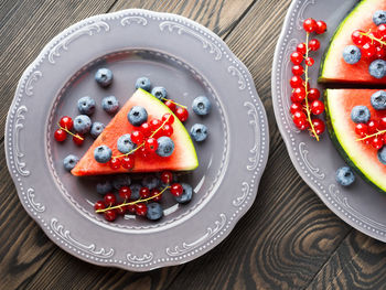 High angle view of fruits in plate on table