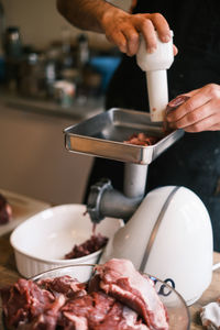 Close-up of man preparing food