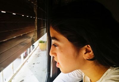 Portrait of mature man looking away at window