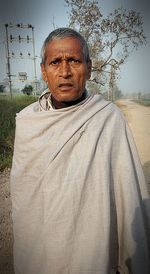 Portrait of man standing outdoors