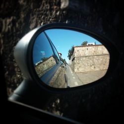 Reflection of car on side-view mirror