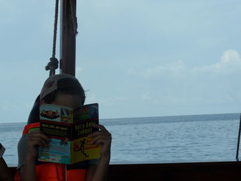 Man on beach against sky