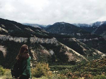 Rear view of woman looking at mountains