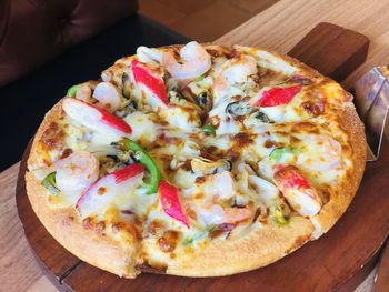 Close-up of pizza served on table