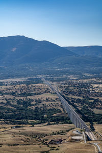 High angle view of road by mountain against sky