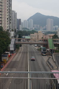 High angle view of traffic on road amidst buildings in city
