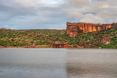 Temple on the shores of lake with mountain in background