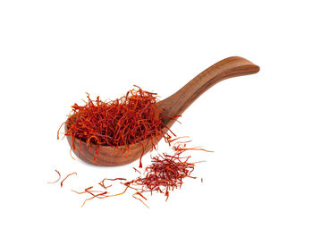 Close-up of red chili pepper against white background