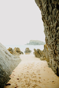 Scenic view of beach against clear sky