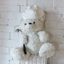 Close-up of stuffed toy against white wall