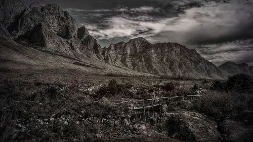 Scenic view of landscape and mountains against sky