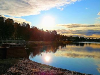 Scenic view of lake against sky during sunset