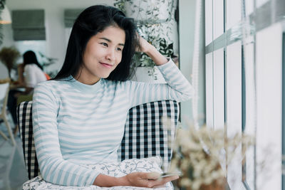 Portrait of a smiling young woman