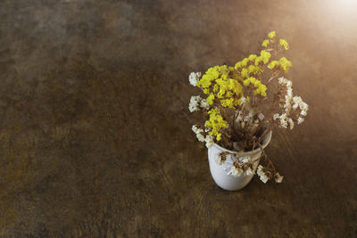 High angle view of flower vase on table