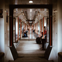 People sitting in corridor of building