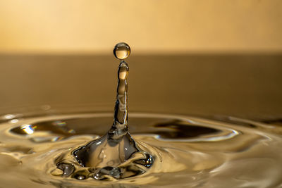 Close-up of drop falling in water