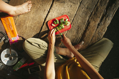 People preparing food at camp barefoot