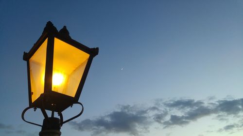 Illuminated road sign at night