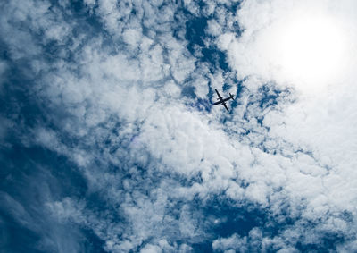 Low angle view of airplane flying in sky