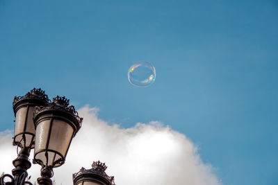 Low angle view soap bubble against sky