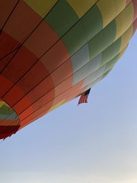 Low angle view of hot air balloons against clear sky