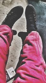 Low section of people with umbrella