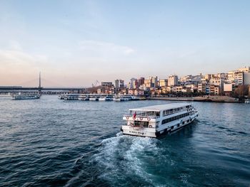Scenic view of sea against sky in city